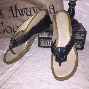 Black leather thong with bucket accent