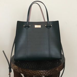 A medium size emerald green Kate spade handbag