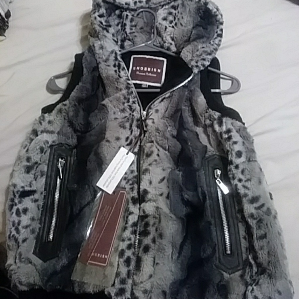 A fur vest with hood