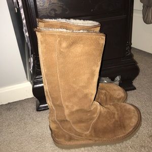 Tall UGG boots with zipper detail