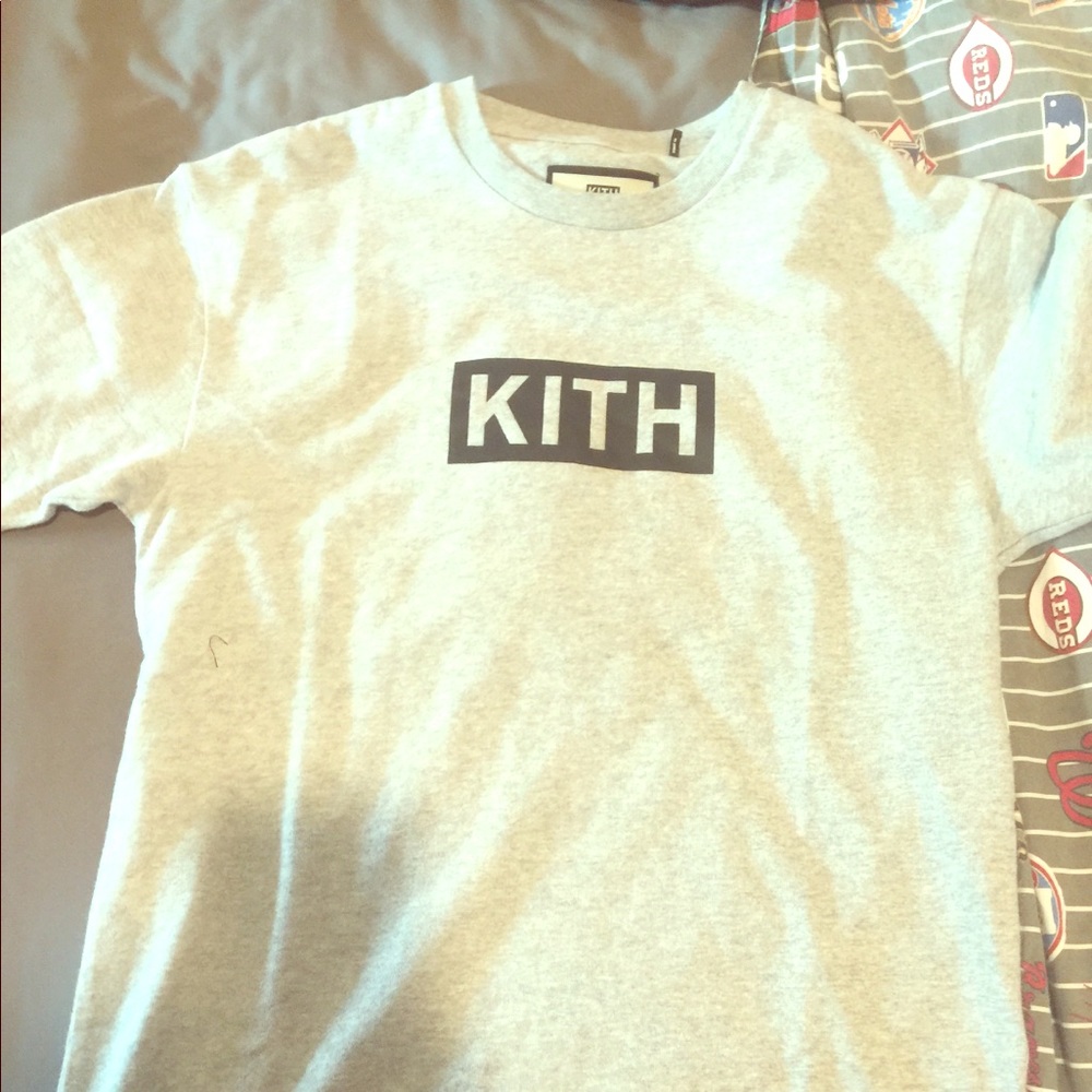 Plain grey Kith shirt with black box logo.