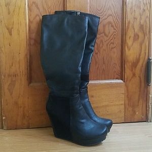 Tall black wedge boots