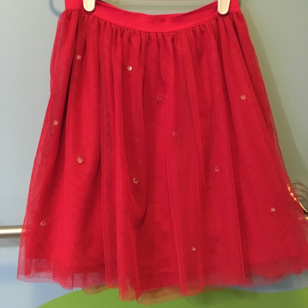 Red tulle skirt with jewel details