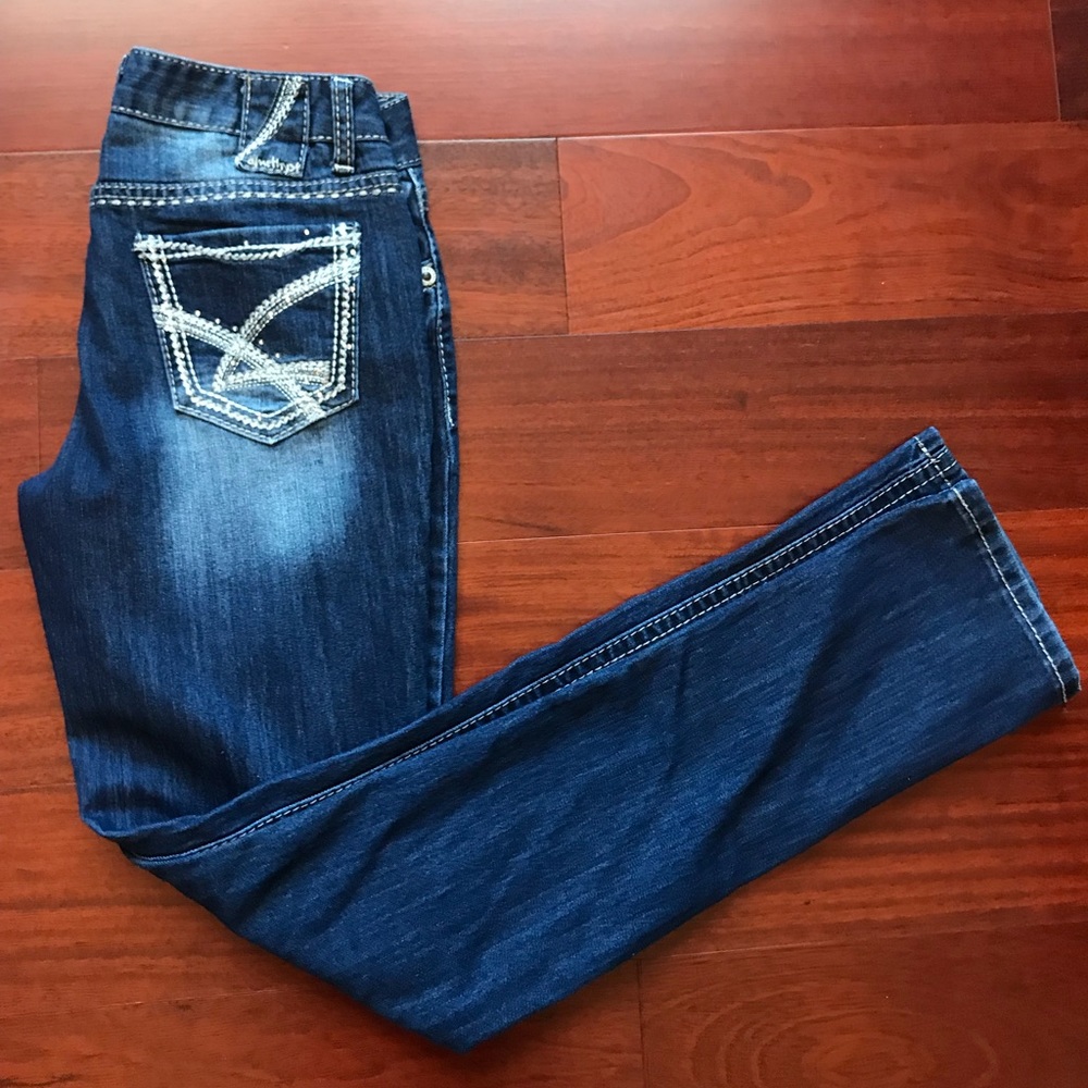 Dark wash skinny jeans with a slight fade
