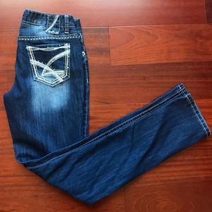 Dark wash skinny jeans with a slight fade