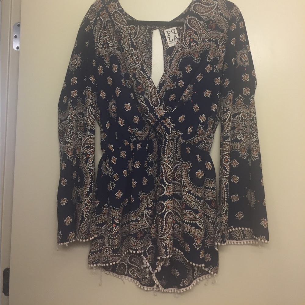 Patterned romper with stretch waist and open back!