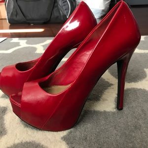 BCBGeneration. Patent leather red peep toe heels.