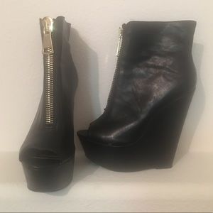 Black wedge booties.