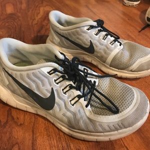 Grey Nike shoes, worn but still in good shape