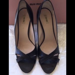 Miu Miu cross strap black sandals
