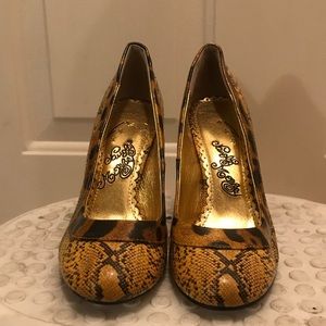 Yellow and black snakeskin heels by Naughty Monkey