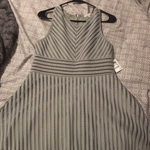 An army green dress with mesh detailing