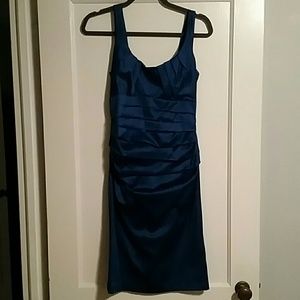 Blue cocktail dress with ruching at waist.