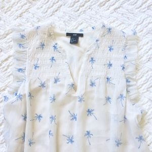 H&M blue palm tree sleeveless blouse size 4 H&M blue palm tree sleeveless blouse size 4