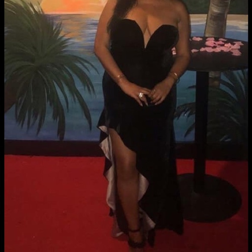 Long black strapless velvet gown.