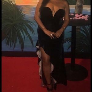 Long black strapless velvet gown.