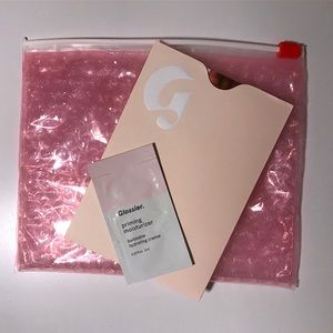 Glossier pouch in white Glossier box.