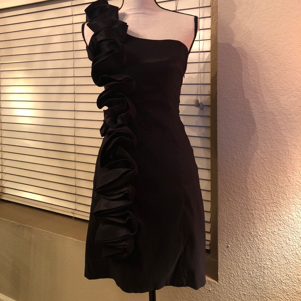 Black one shoulder dress.