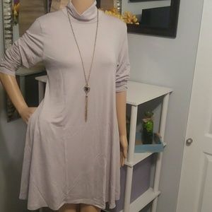 Light grey loose-fitting turtleneck dress
