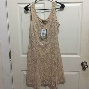 Nude lace dress with silver accents