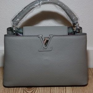 Capucines BB leather handbag with shoulder strap Capucines BB leather handbag with shoulder strap