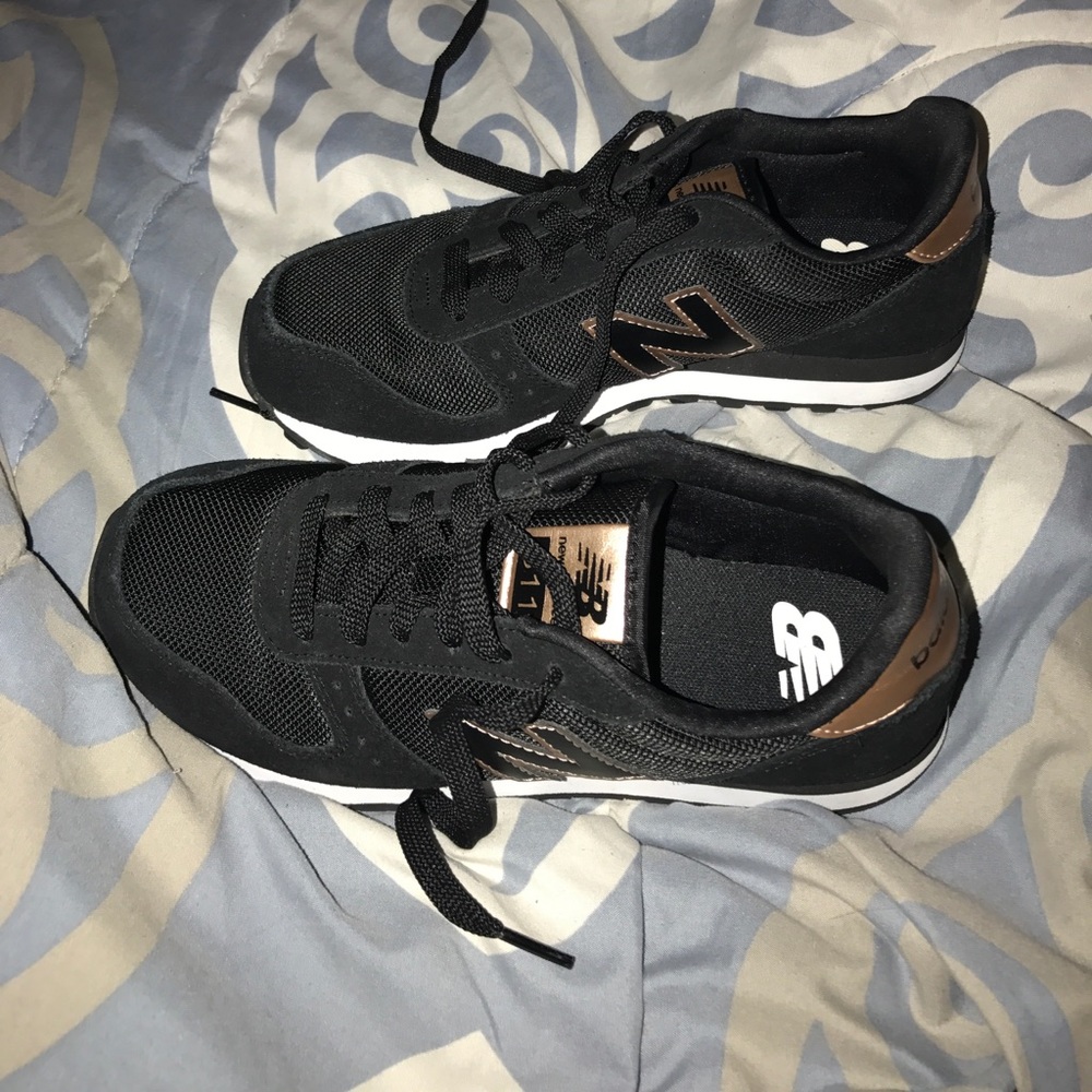 Black and gold suede new balance shoe