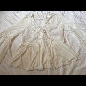 Lace up white blouse with winged arms