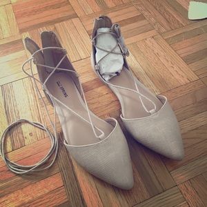 Beige tie up flats