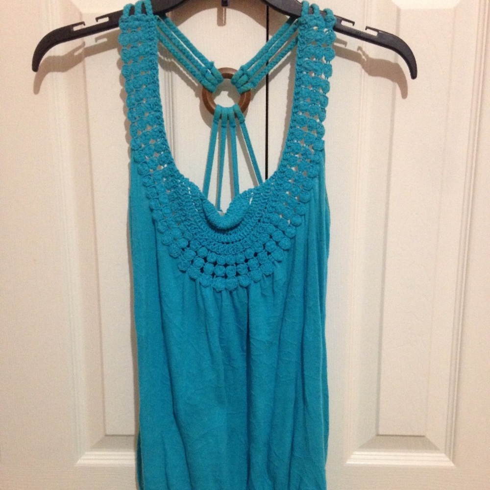 Super cute blue tank with interesting back