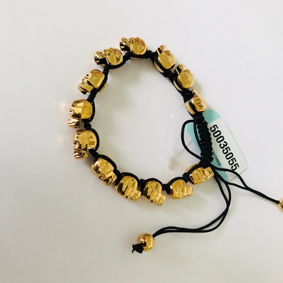 Golden skull bracelet with adjustable black cord - Picture 8 of 8