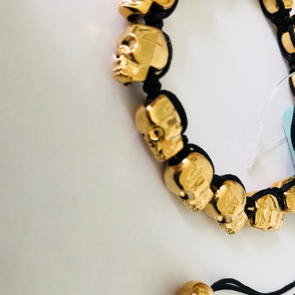 Golden skull bracelet with adjustable black cord - Picture 2 of 8