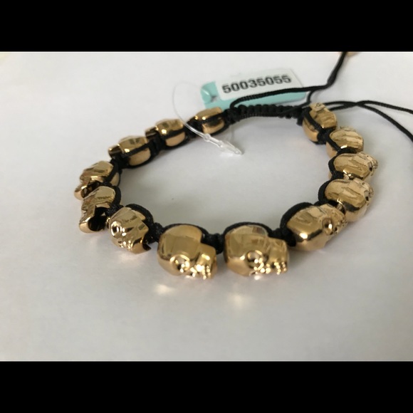Golden skull bracelet with adjustable black cord - Picture 7 of 8