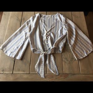 Silky crop top with blue floral designs