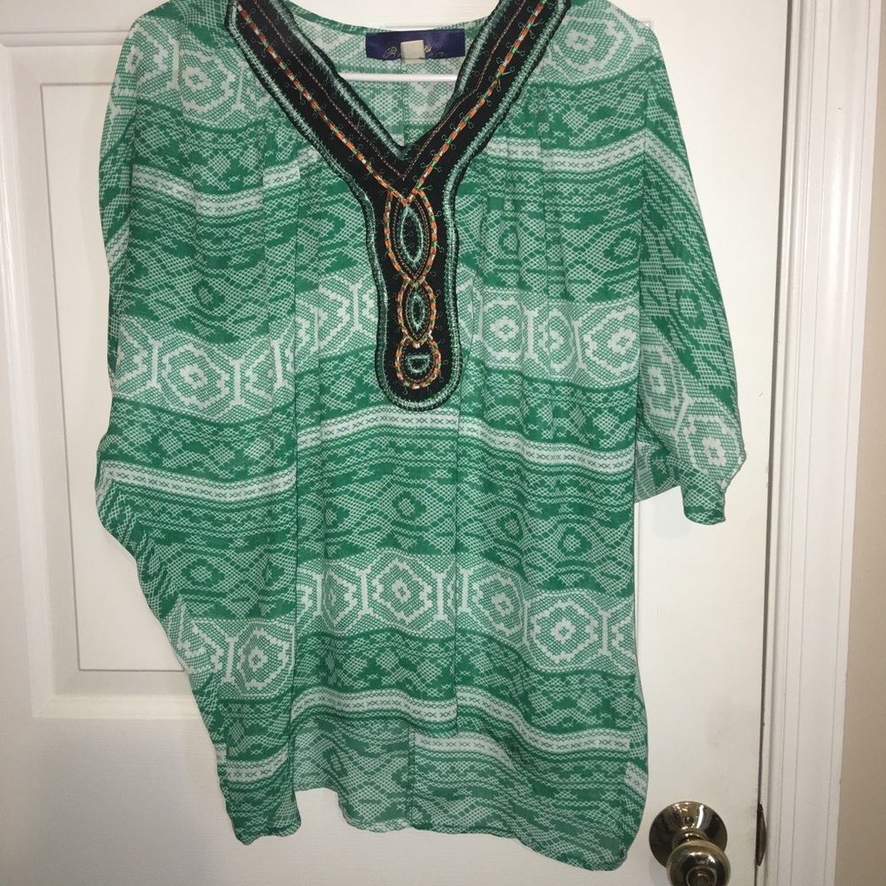 Green silk blouse with stitched neckline
