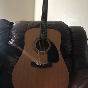 Black and also another brown acoustic guitar