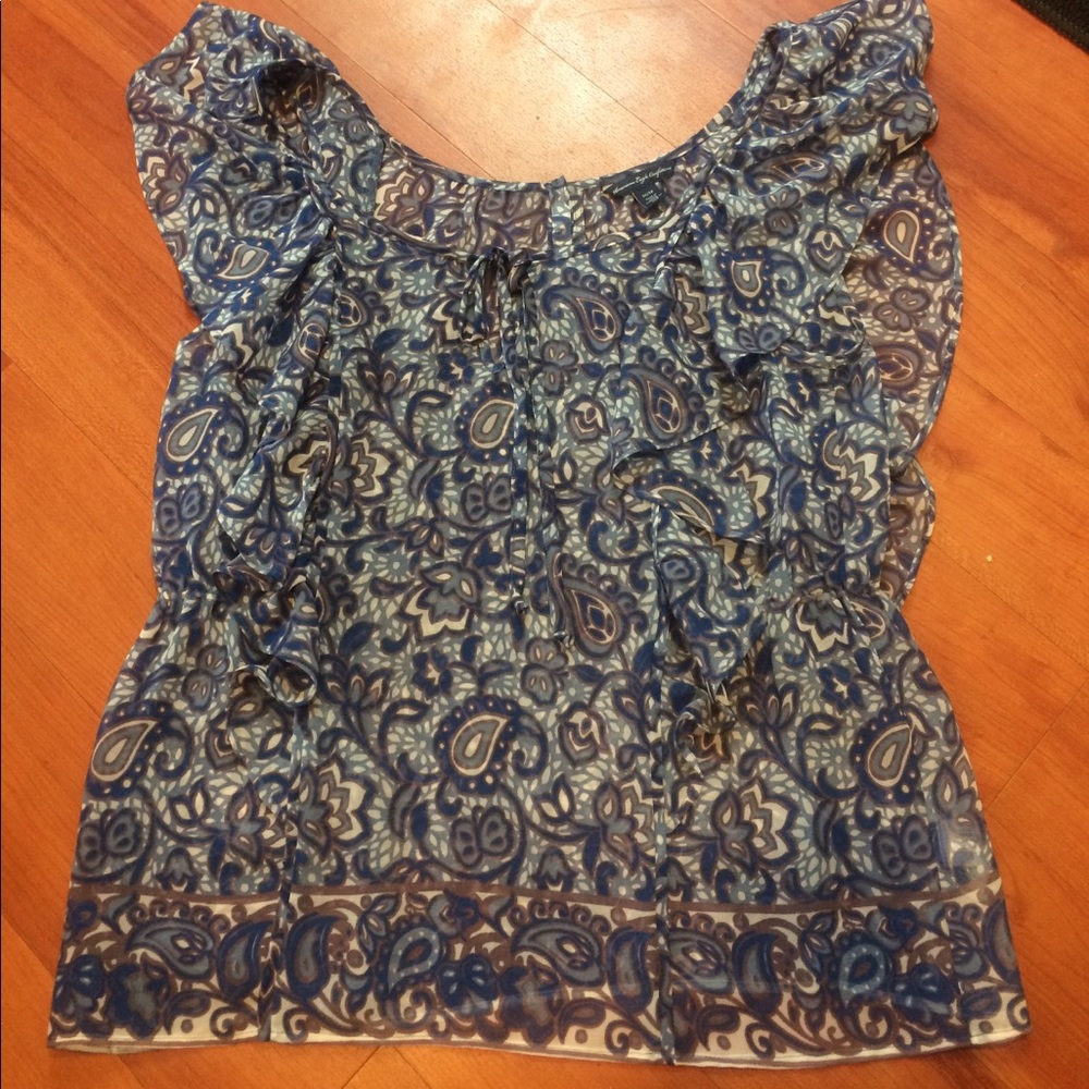 Pretty Blue design ruffle blouse with tie in front