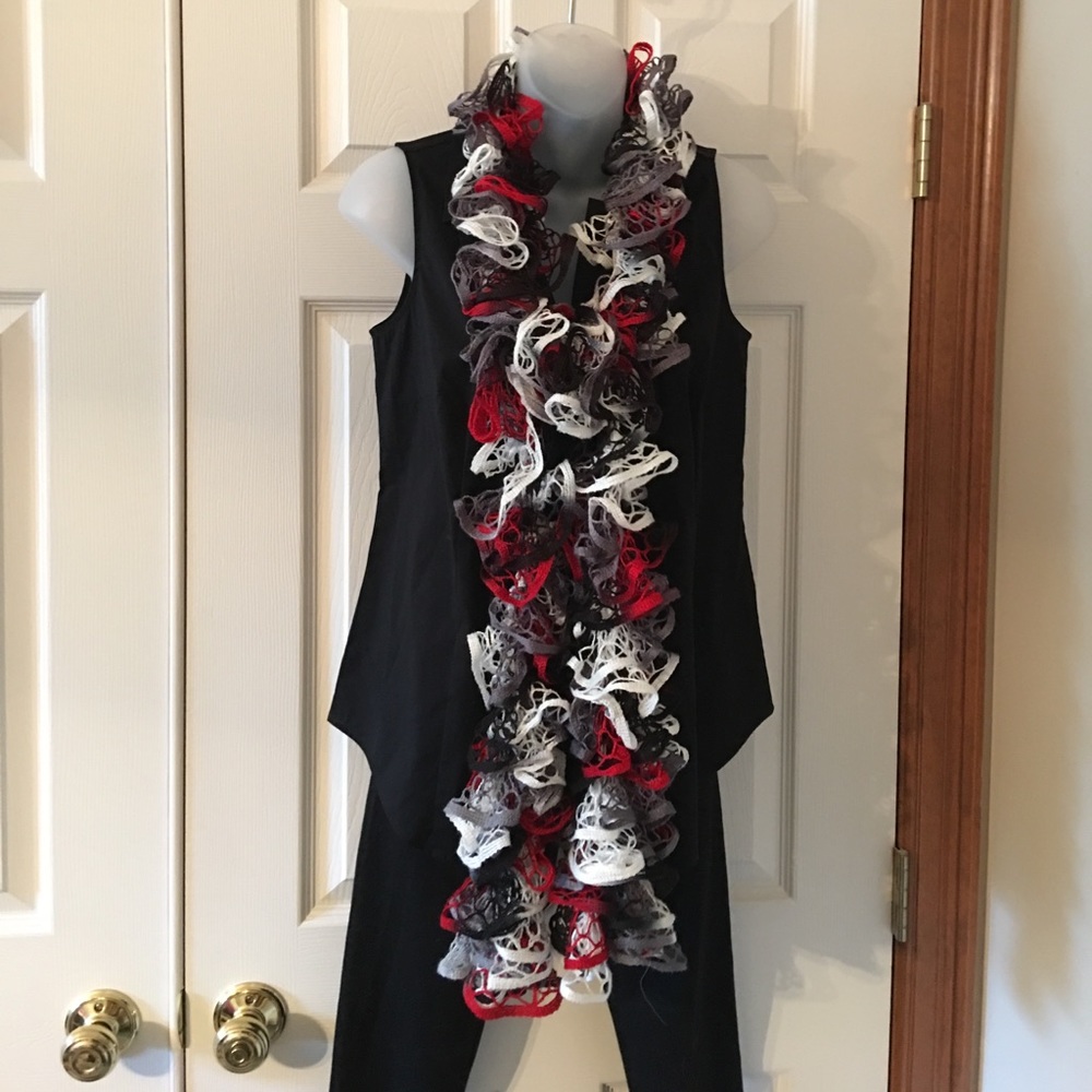 Hand crocheted ruffle scarf. 68” long.