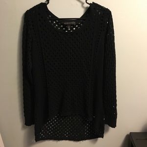 All black shirt with holes in it