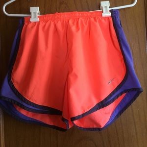 Nike purple and bright orange running shorts