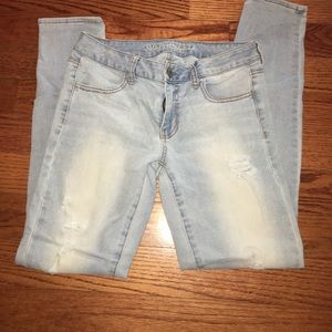 Light wash, machine distressed skinny jeans