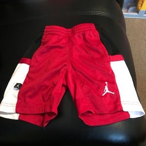 Boys red and black Jordan/ Nike mwah shorts.