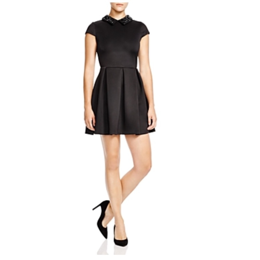 Black cocktail dress with detailed collar
