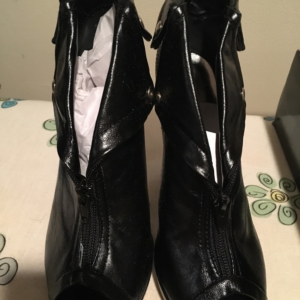 Peep toe black booties.