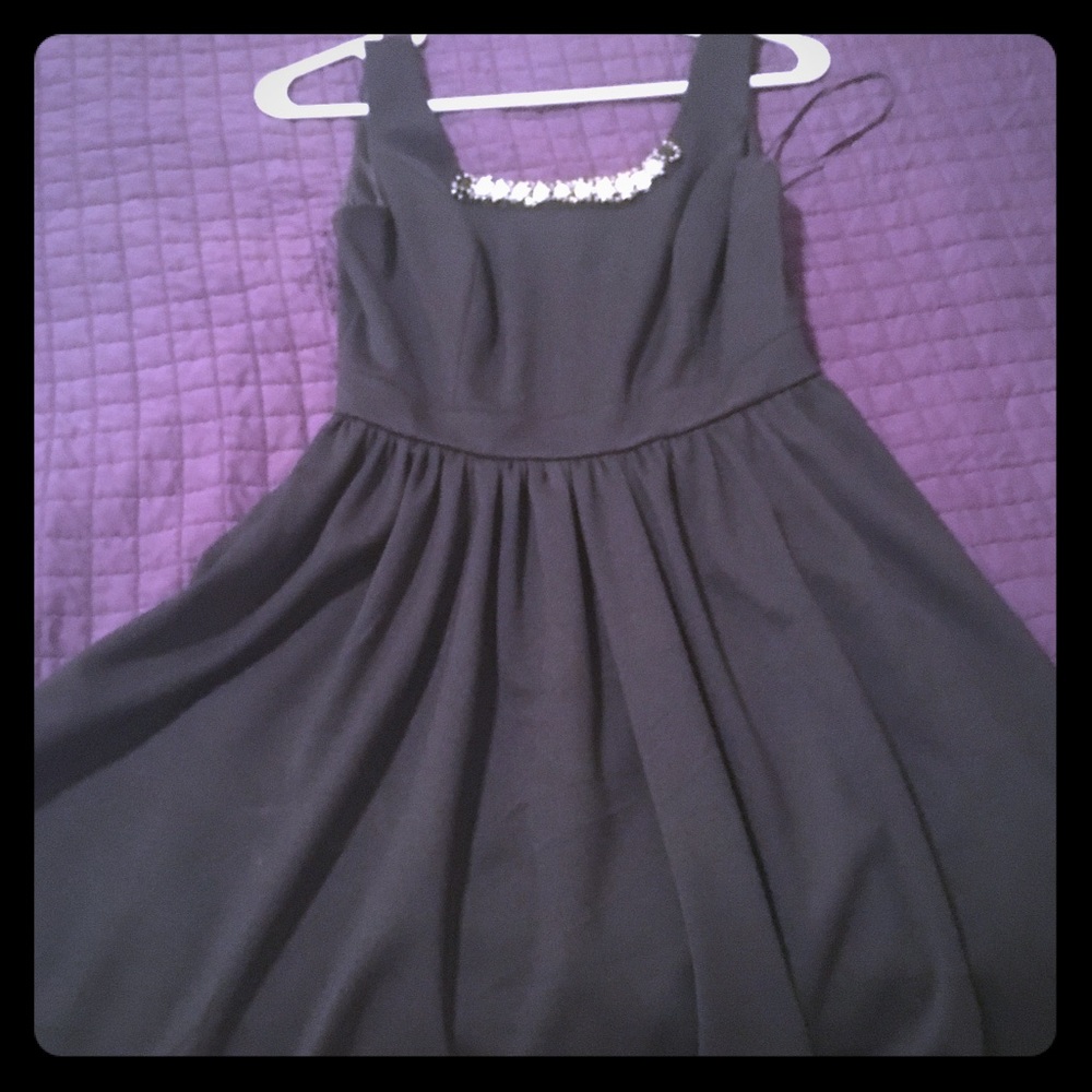 Black cocktail dress with rhinestones at neckline