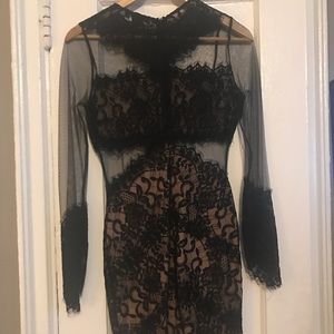 Pretty black lace semi sheer dress.