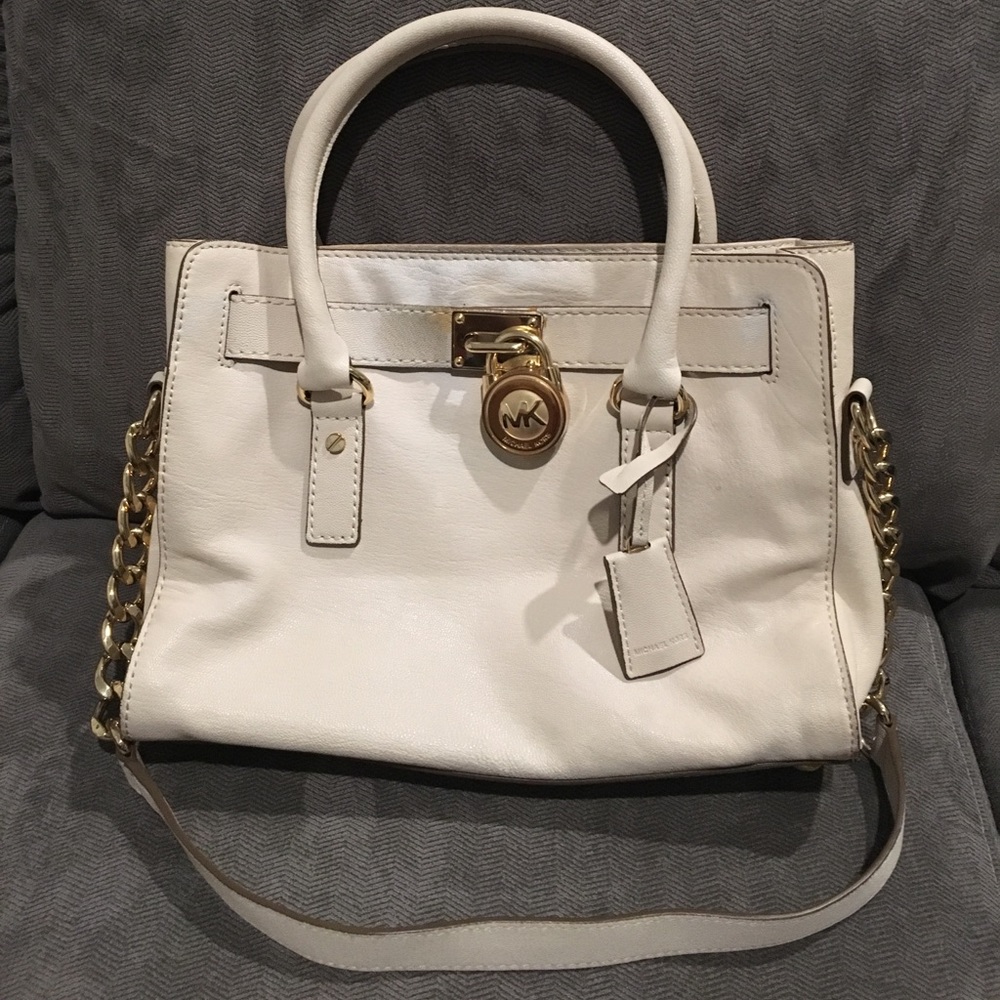 Cream Michael Kors bag with duster