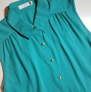 Turquoise sleeveless, collared top