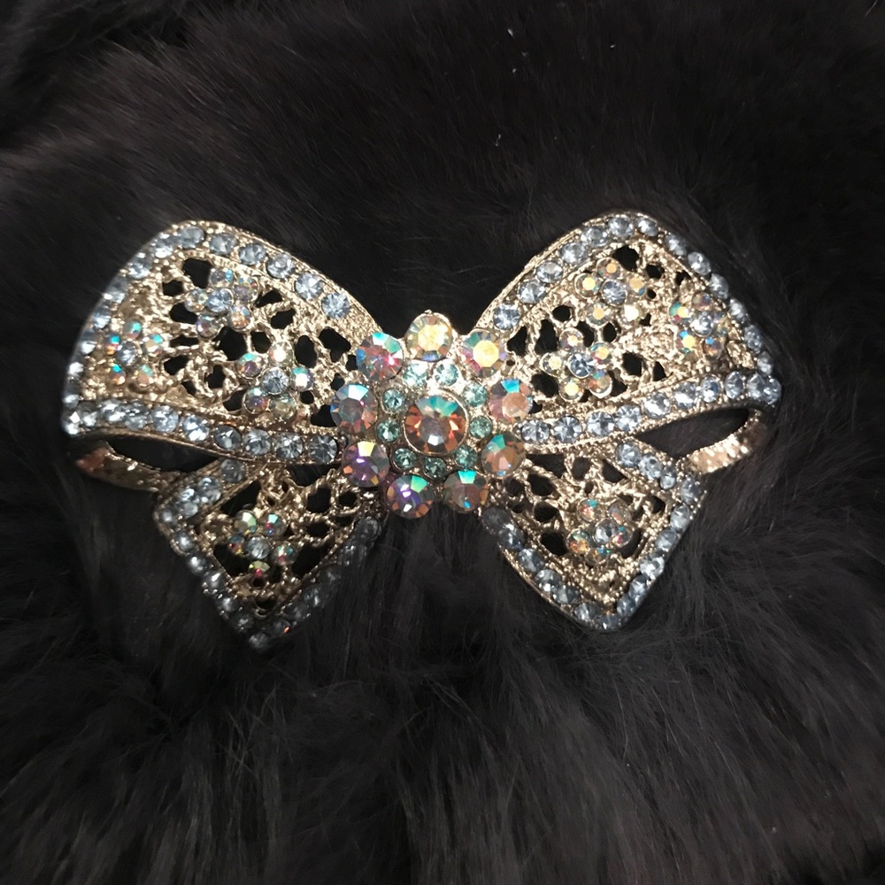 Silver metal blue crystal bow brooch