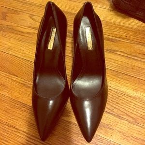 Black leather pumps