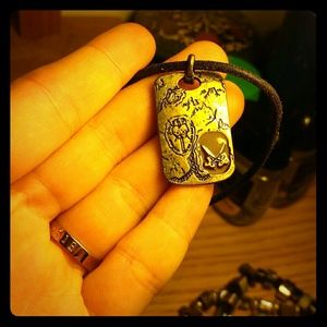 Leather cord pirate treasure map necklace.